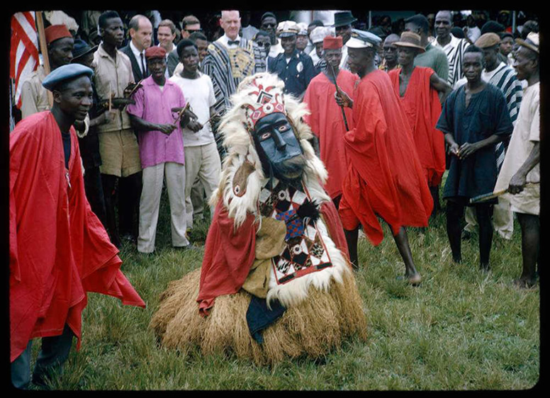 In an image from 1964, a country devil and his attendants prepare for a procession in Lofa County, Liberia. Willie A. Whitten/Indiana University Liberian Collection
